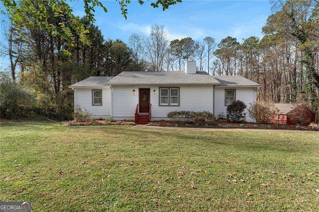 single story home with a front lawn