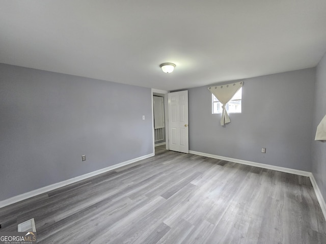 unfurnished bedroom featuring wood-type flooring