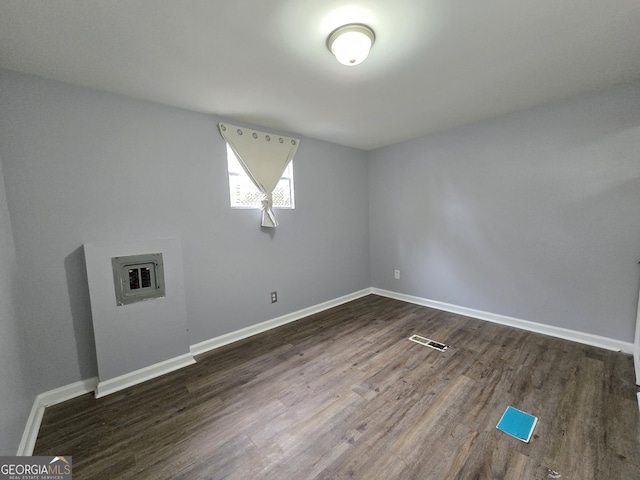 empty room featuring dark hardwood / wood-style flooring