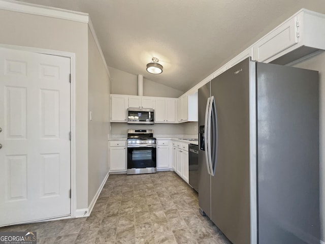 kitchen with appliances with stainless steel finishes, ornamental molding, a textured ceiling, vaulted ceiling, and white cabinetry