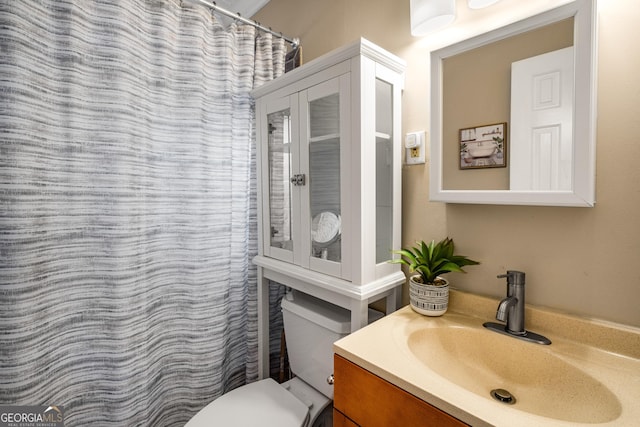 bathroom with vanity and toilet