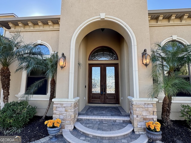 property entrance featuring french doors