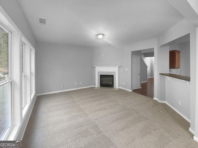 unfurnished living room with carpet