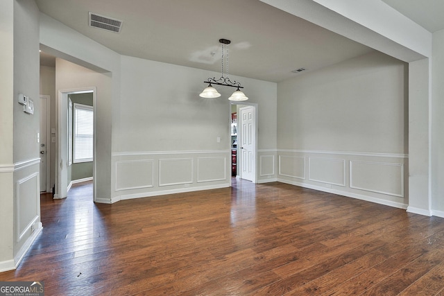 unfurnished room featuring dark hardwood / wood-style floors