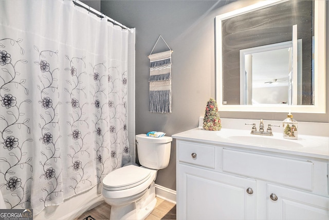 full bathroom with vanity, wood-type flooring, shower / bath combo, and toilet