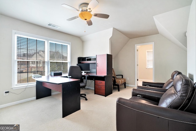 carpeted office space with lofted ceiling and ceiling fan