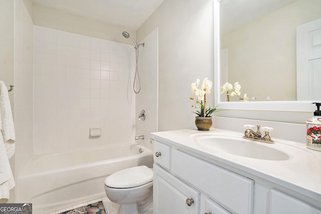 full bathroom with tiled shower / bath combo, vanity, tile patterned flooring, and toilet