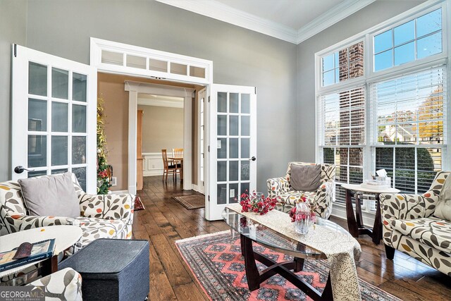 living room with crown molding and dark wood-type flooring