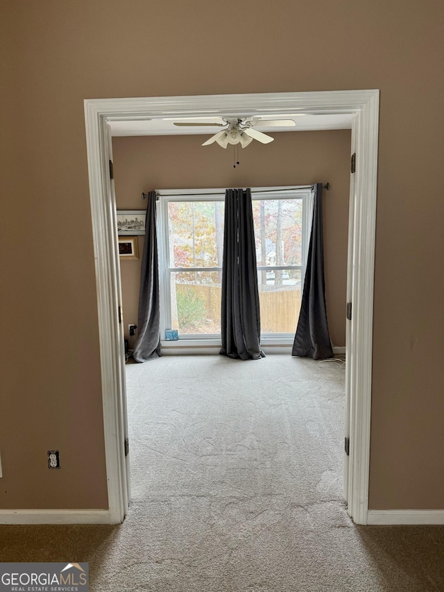 corridor with light colored carpet