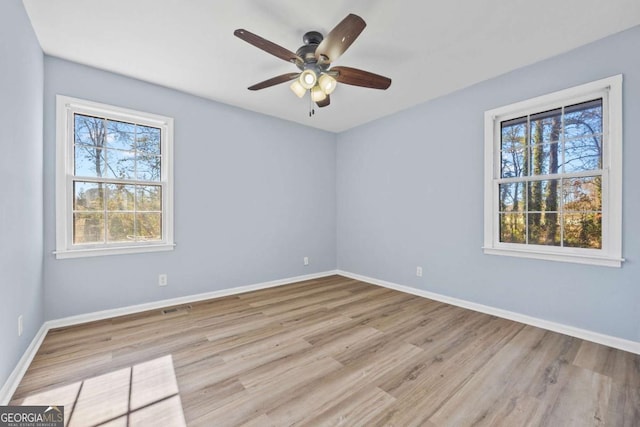 unfurnished room featuring ceiling fan and light hardwood / wood-style floors