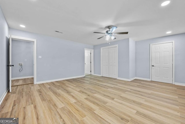 unfurnished room with ceiling fan and light hardwood / wood-style floors