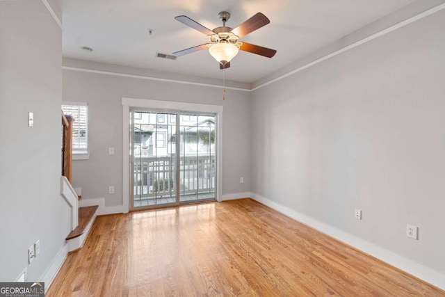 spare room with light hardwood / wood-style floors and ceiling fan