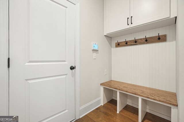 mudroom with dark wood-type flooring