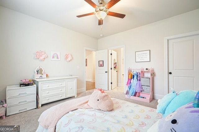 bedroom featuring ceiling fan and light carpet