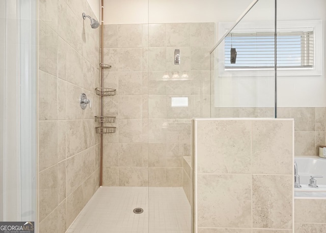 bathroom with a tile shower