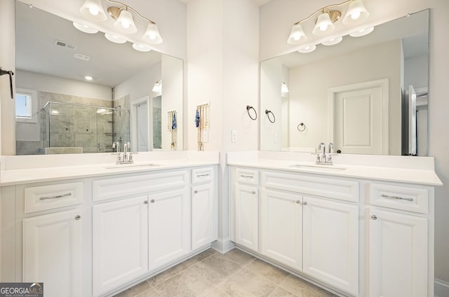 bathroom with a shower with door and vanity