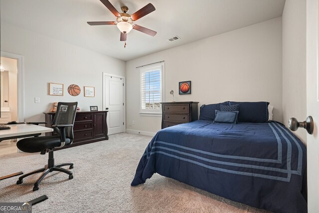 bedroom with ceiling fan and carpet