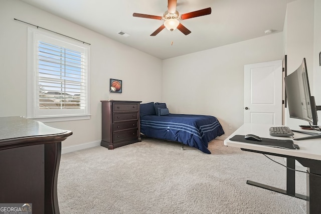 bedroom featuring ceiling fan and light carpet