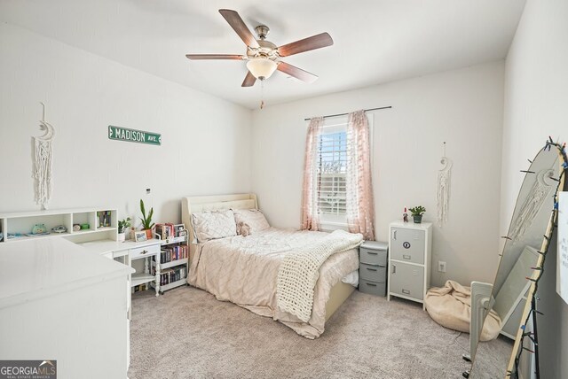 carpeted bedroom featuring ceiling fan