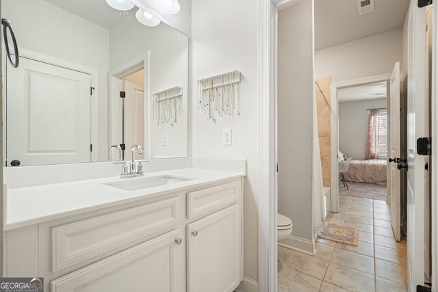 full bathroom with toilet, shower / washtub combination, tile patterned flooring, and vanity