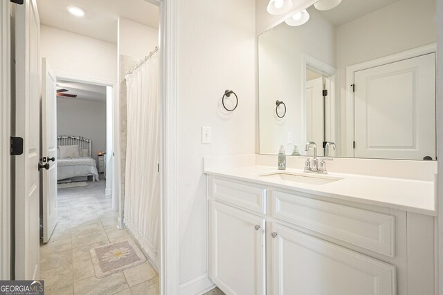 bathroom featuring ceiling fan and vanity