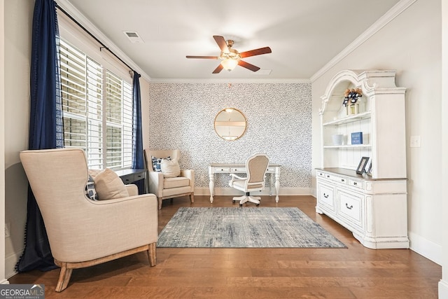 sitting room featuring ornamental molding, ceiling fan, and hardwood / wood-style flooring