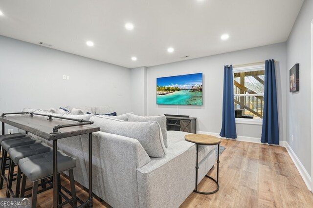 living room with light hardwood / wood-style floors