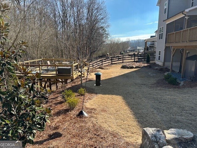 view of yard featuring a wooden deck