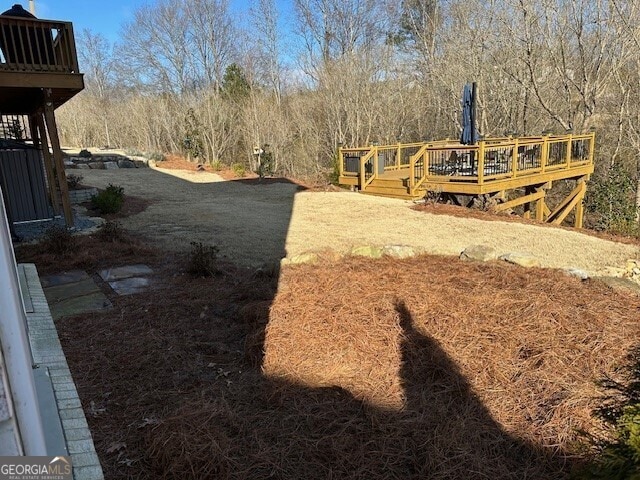 view of yard featuring a wooden deck