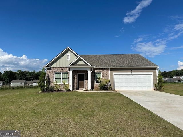 view of front facade featuring a front yard and a garage