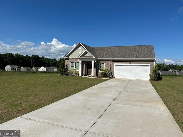 view of front of property featuring a front lawn and a garage