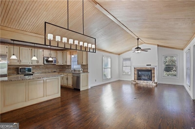 kitchen with wood ceiling, appliances with stainless steel finishes, light stone countertops, decorative backsplash, and cream cabinetry