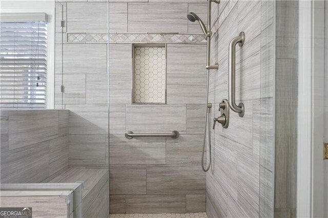 bathroom with tiled shower