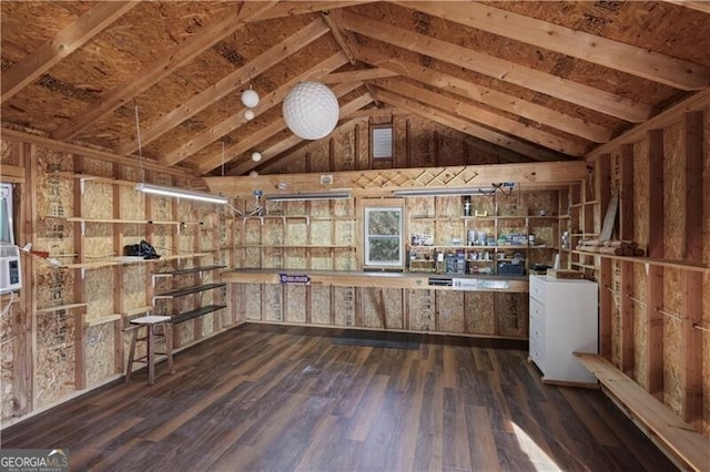 miscellaneous room with dark hardwood / wood-style flooring and vaulted ceiling