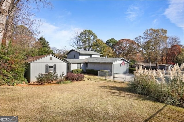 exterior space with a garage and a front lawn