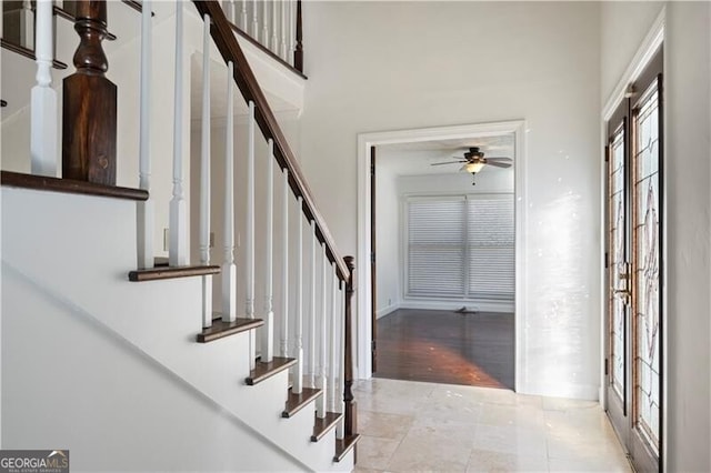 foyer featuring ceiling fan