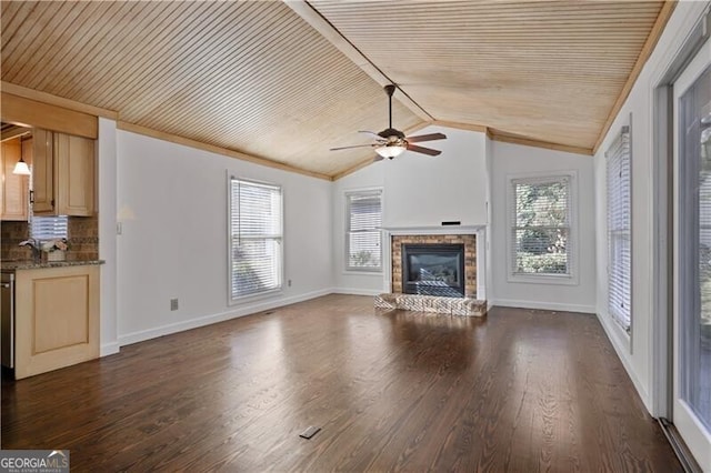 unfurnished living room featuring lofted ceiling, dark wood-type flooring, wooden ceiling, and ceiling fan