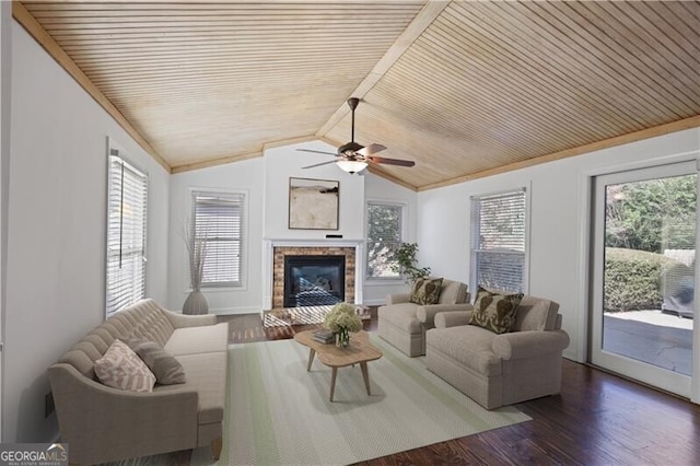 living room with dark wood-type flooring, a healthy amount of sunlight, and wooden ceiling