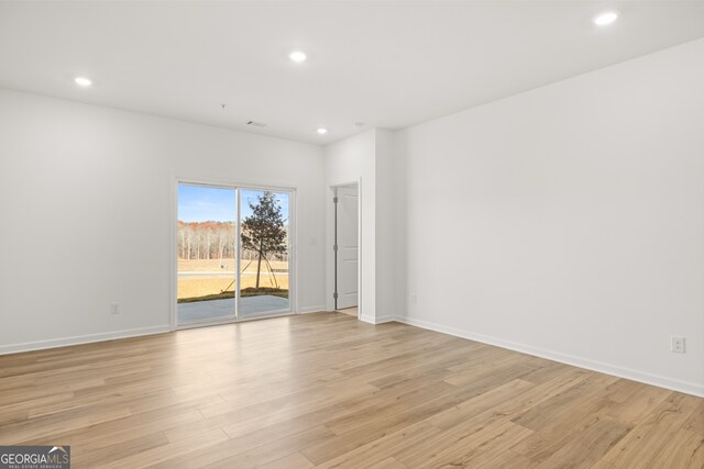 empty room with light wood-type flooring