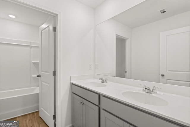 bathroom featuring vanity and hardwood / wood-style flooring