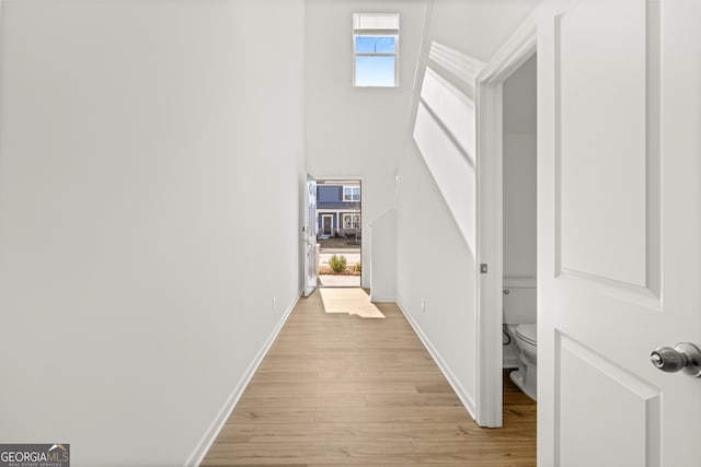 corridor featuring light hardwood / wood-style flooring