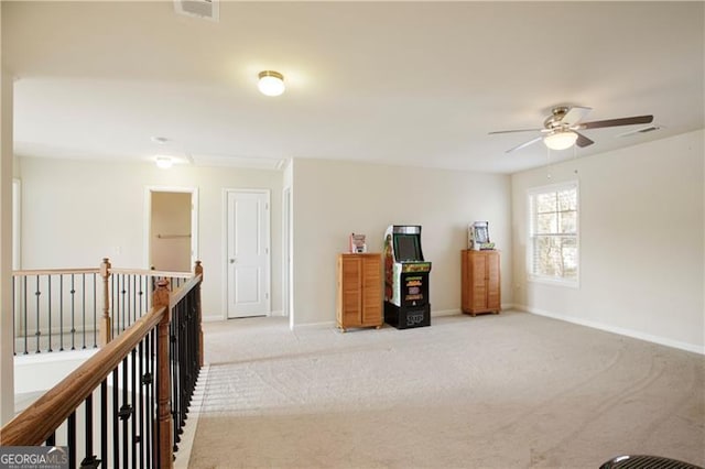 interior space with ceiling fan