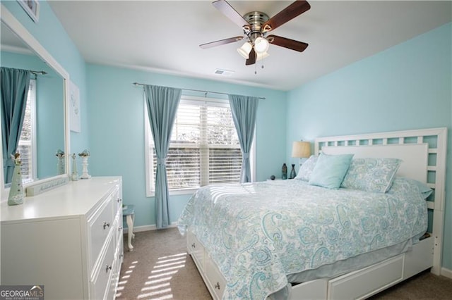 carpeted bedroom featuring ceiling fan