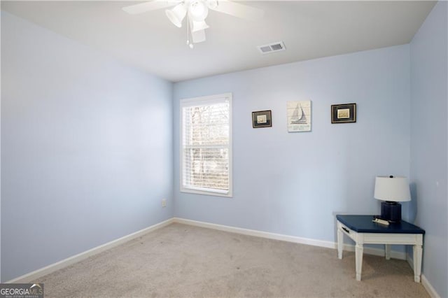 carpeted empty room with ceiling fan