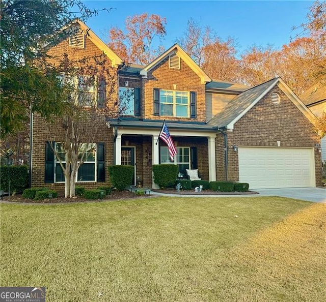 view of front facade with a garage and a front lawn