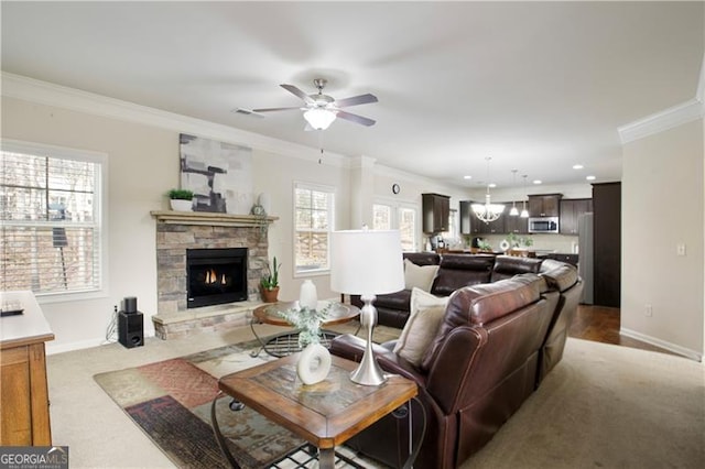 living room featuring a fireplace, carpet, and ornamental molding