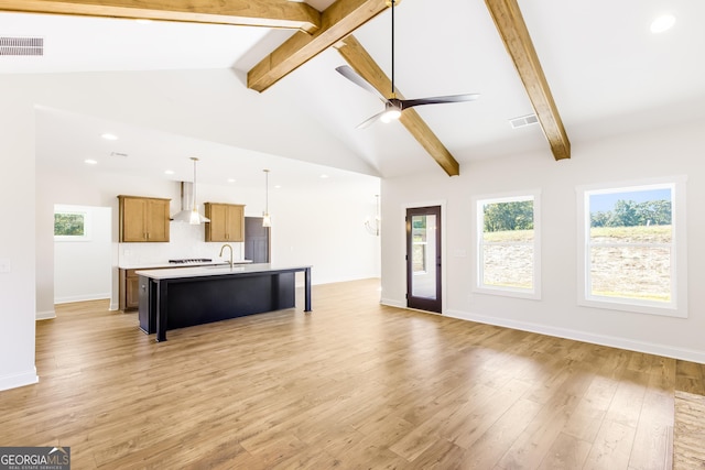 living room with high vaulted ceiling, sink, ceiling fan, light wood-type flooring, and beamed ceiling