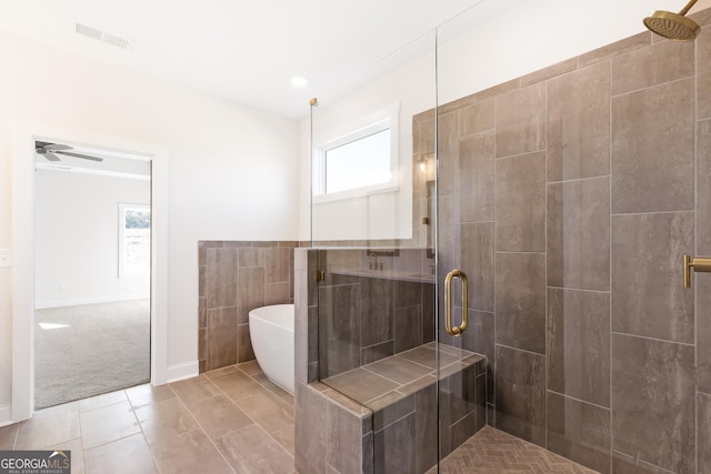 bathroom featuring tile patterned floors, ceiling fan, and independent shower and bath