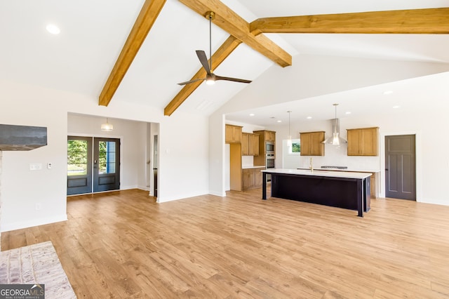 unfurnished living room featuring french doors, ceiling fan, high vaulted ceiling, beamed ceiling, and light hardwood / wood-style floors