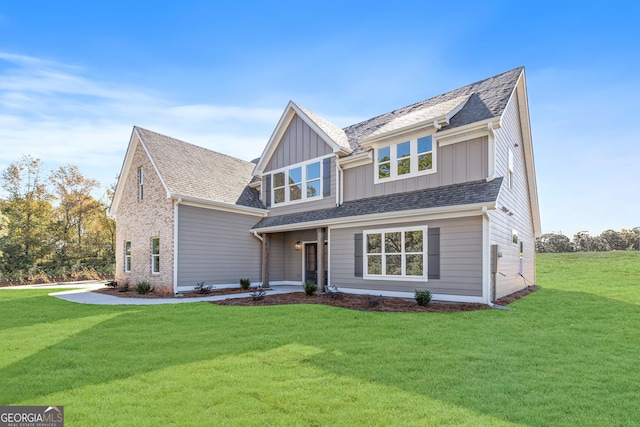 craftsman inspired home with a front lawn